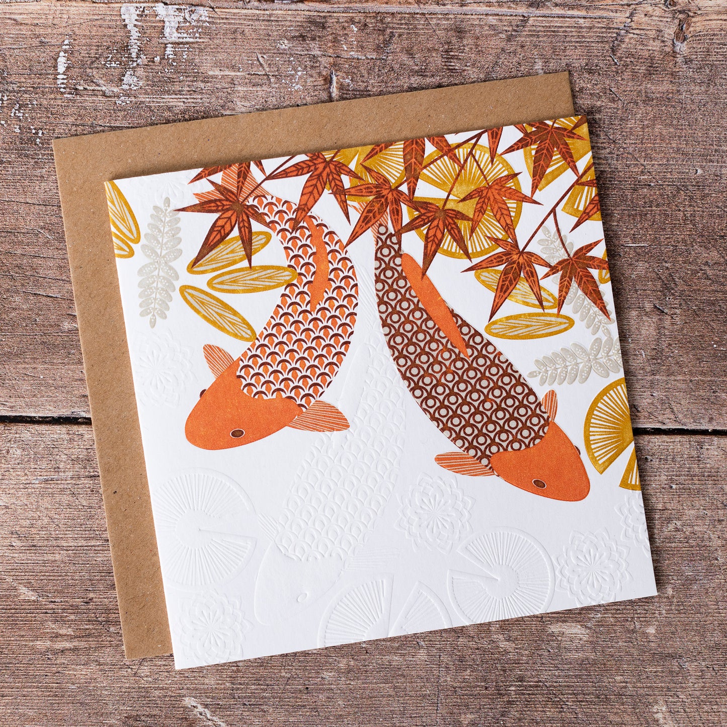 This high quality, linocut printed, Koi card has been handcrafted by the talented Ashley Hutchinson in his rural West Sussex garden studio. This design features two swimming koi on an embossed card background.