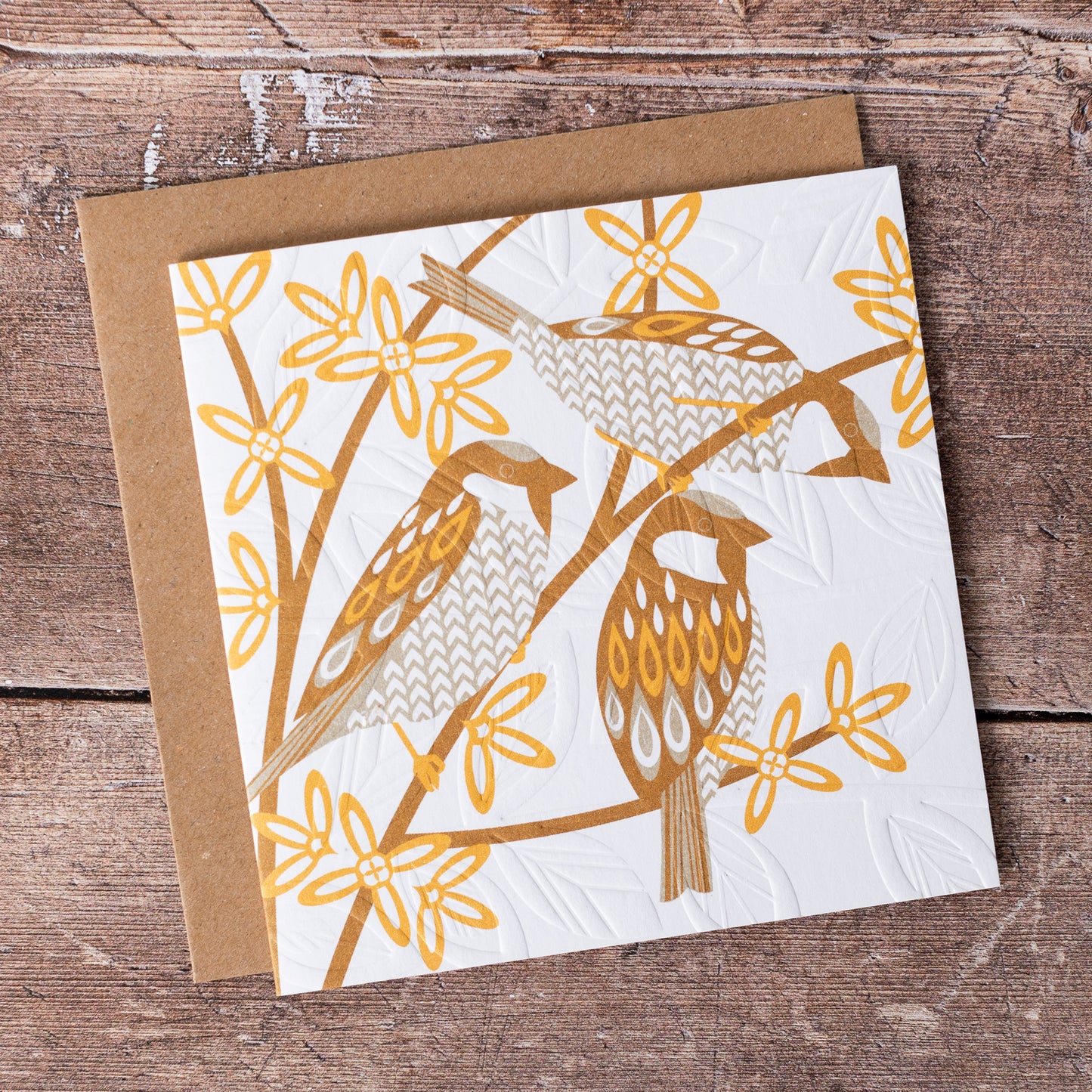 This high quality, linocut printed, Sparrow card has been handcrafted by the talented Ashley Hutchinson in his rural West Sussex garden studio. This design features three sparrows sitting in a tree on an embossed card background.