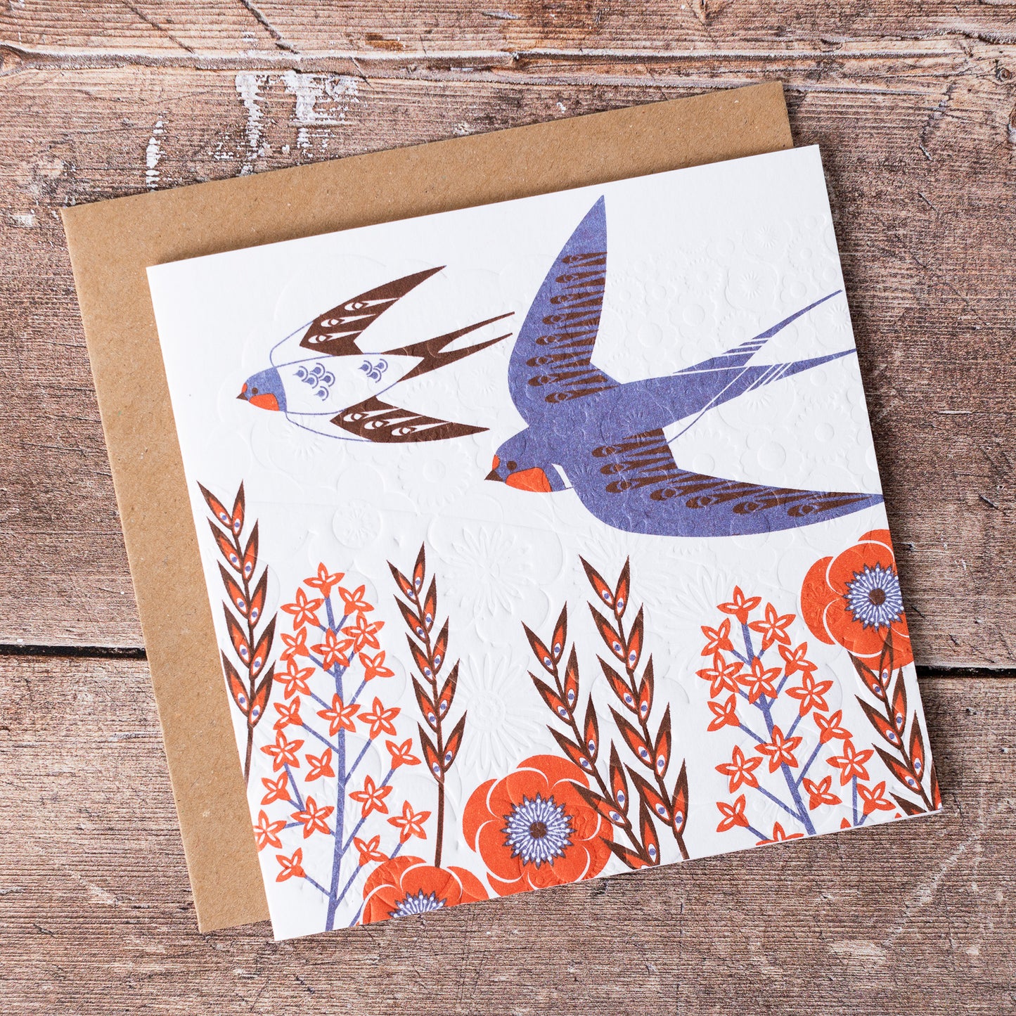This high quality, linocut printed, Swallow card has been handcrafted by the talented Ashley Hutchinson in his rural West Sussex garden studio. This design features a two swallows on an embossed card background.