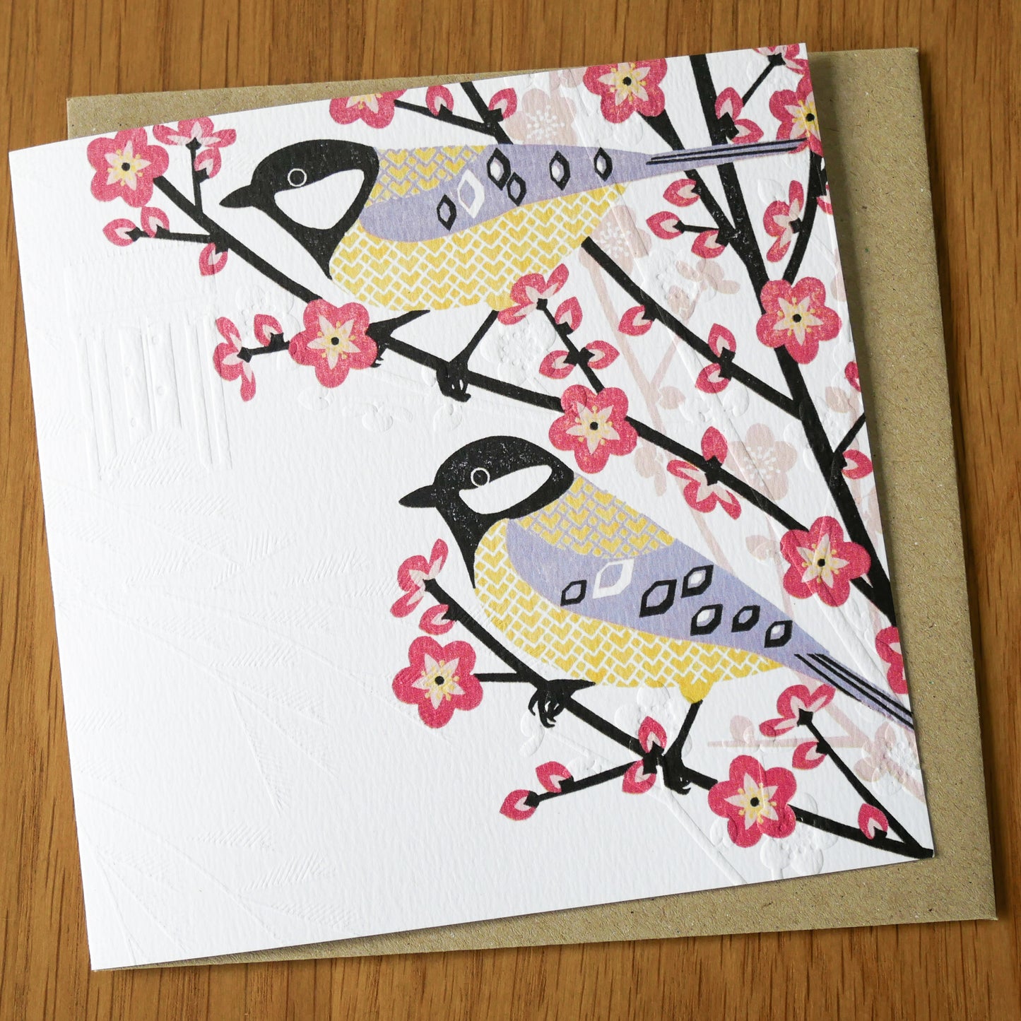 This high quality, linocut printed, Great Tit card has been handcrafted by the talented Ashley Hutchinson in his rural West Sussex garden studio. This design features a two Great Tits in a tree on an embossed card background.