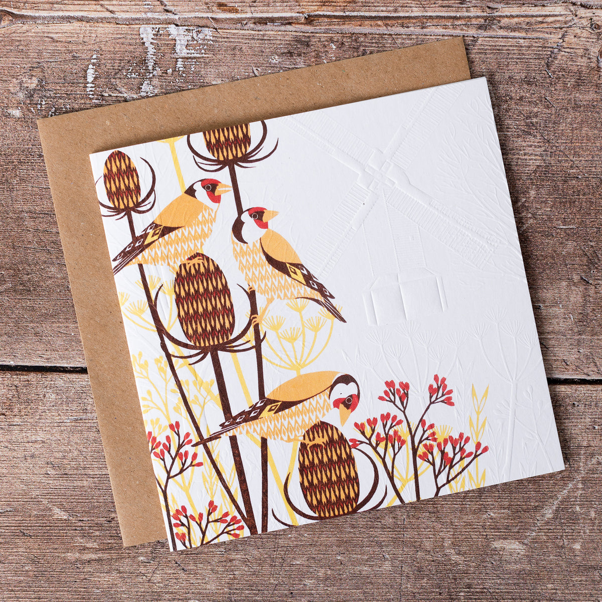 This high quality, linocut printed, Red Squirrel card has been handcrafted by the talented Ashley Hutchinson in his rural West Sussex garden studio.   This design features three Gold finch sitting on teasle on an embossed card background.

