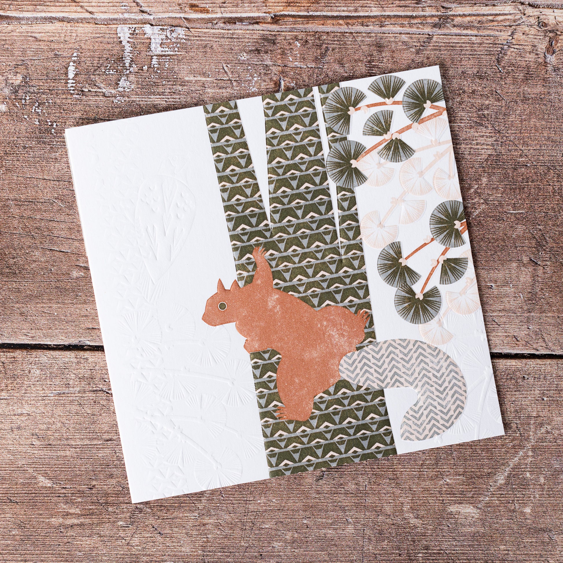 This high quality, linocut printed, Red Squirrel card has been handcrafted by the talented Ashley Hutchinson in his rural West Sussex garden studio.   This design features a red squirrel climbing a tree on an embossed card background.

