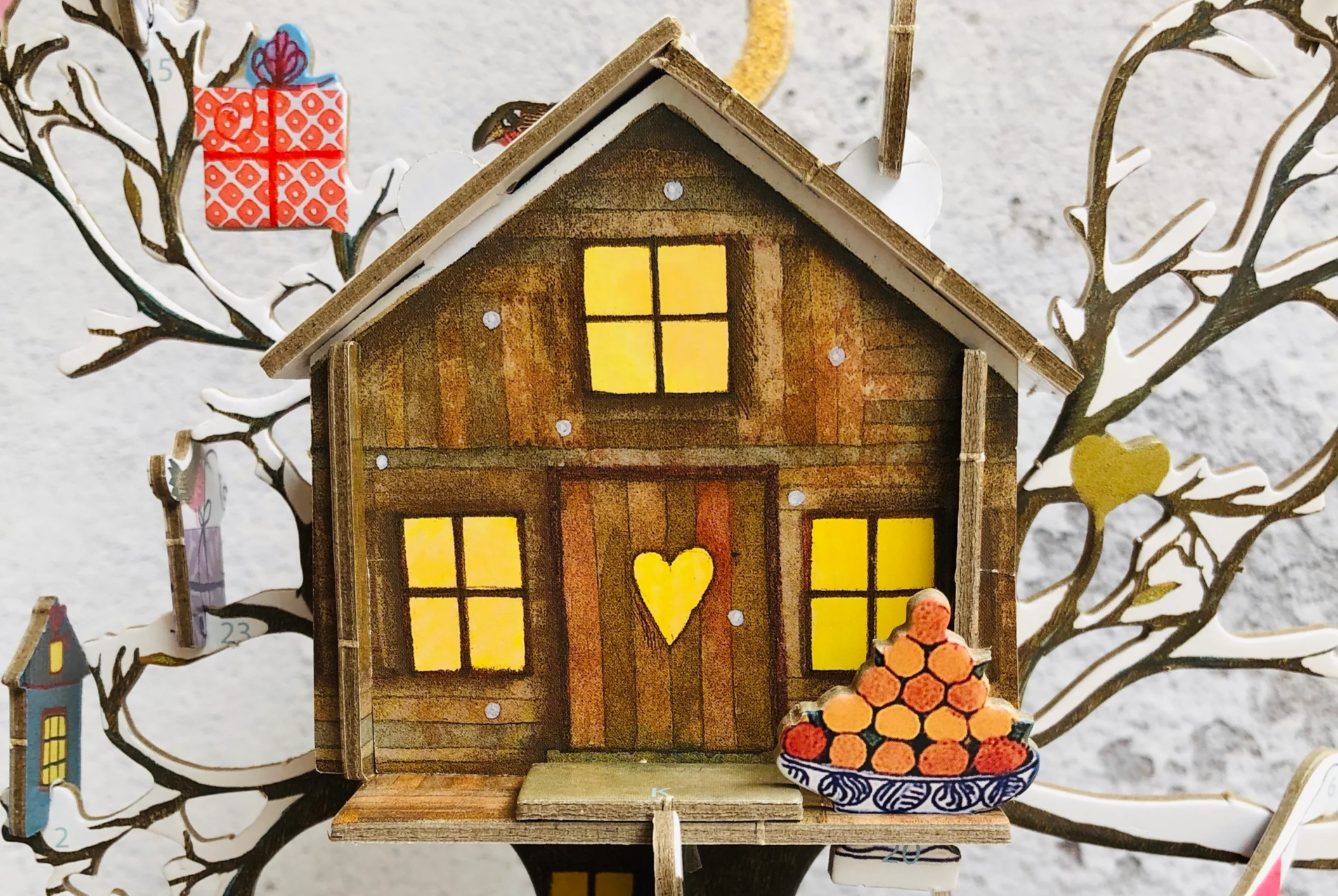 This top selling Christmas Advent Calendar Treehouse design by Jane Ray is an enchanting illustration of a treehouse in a wintry, animal scene. 